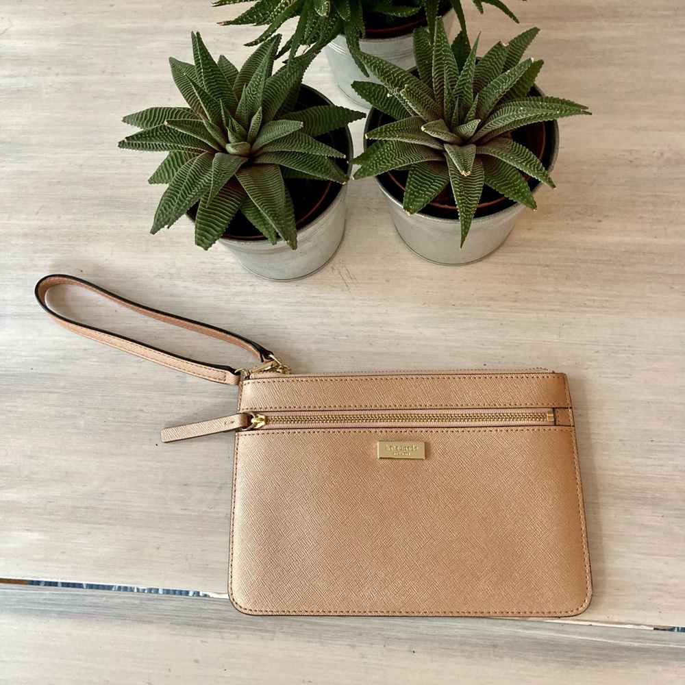 Kate Spade Wristlet Light Pink with Front Zip & Gold Detailing.